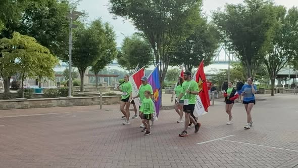 Runners carrying flags