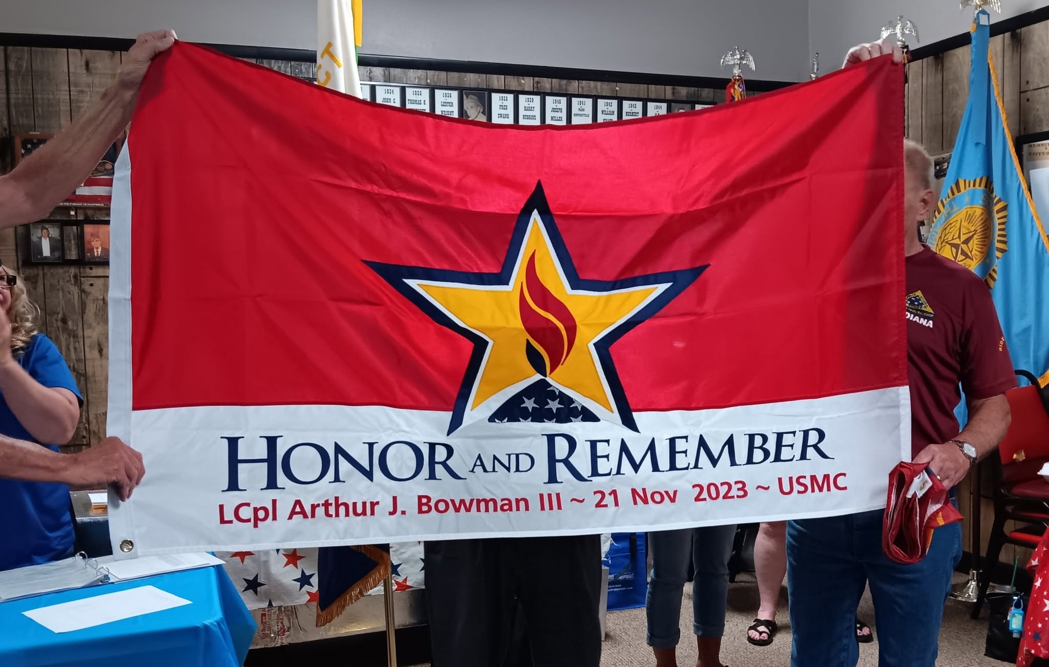 An Honor and Remember flag presented to a family